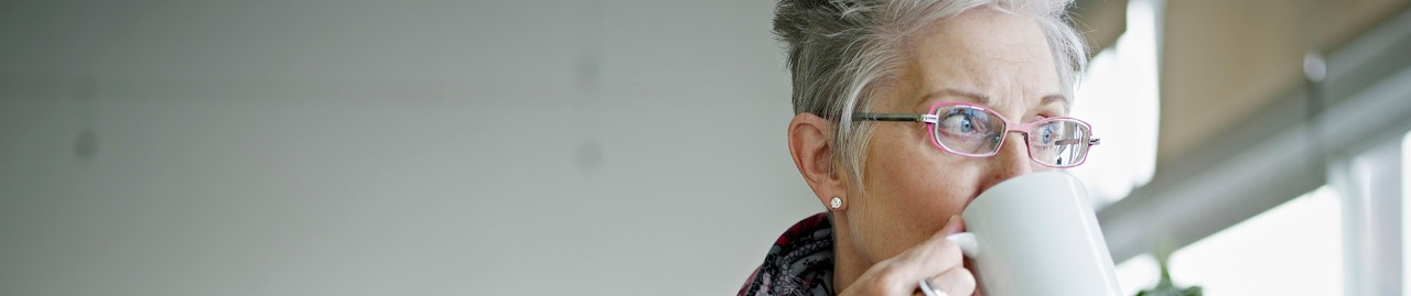 woman drinking from a mug